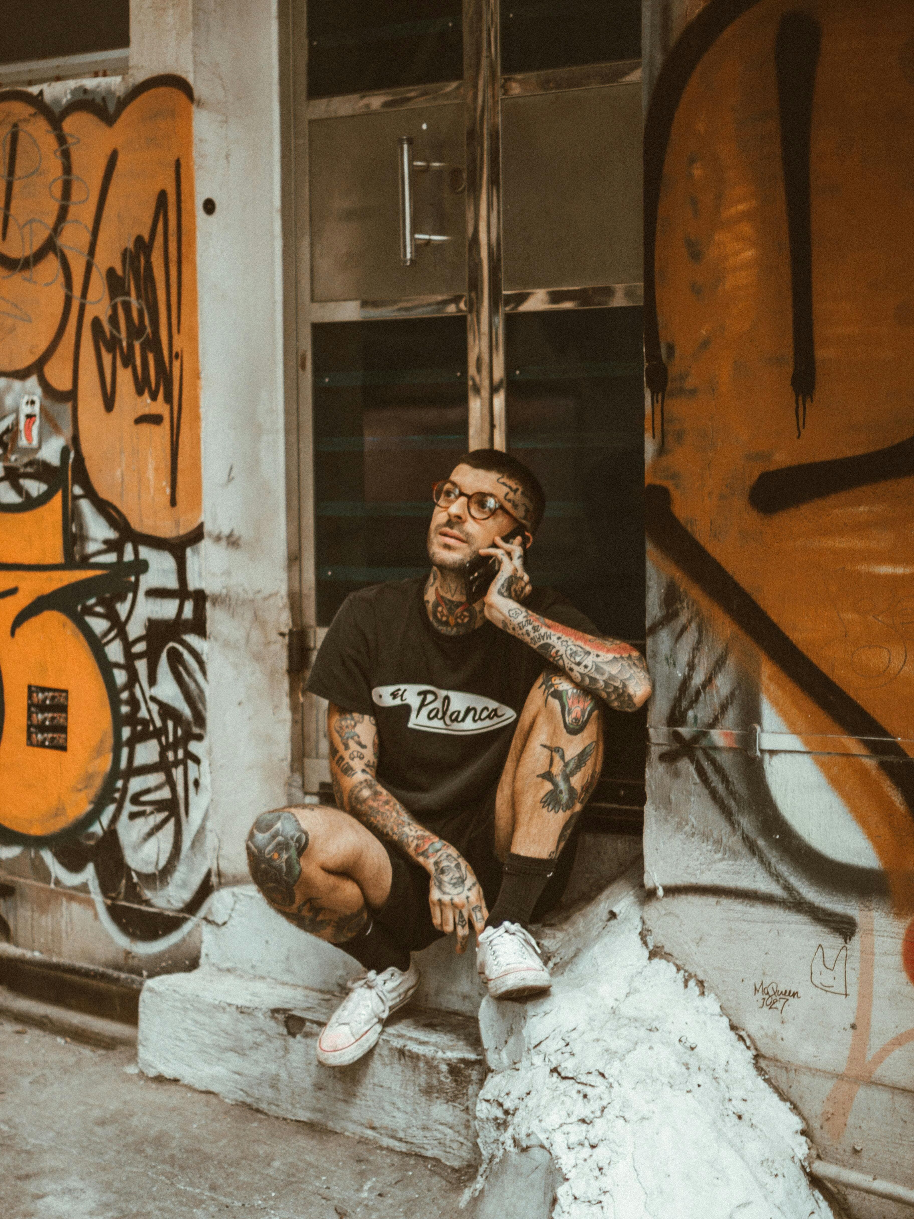 Tattoo artist at work with a full booking calendar